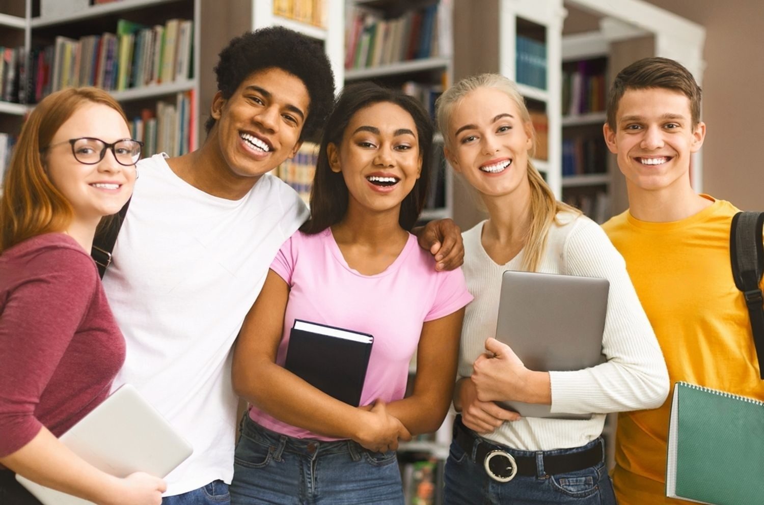 Stock Photo Group Of International Students Studying In Library At University Laughing Together 2471712849 Transformed E1718882589265
