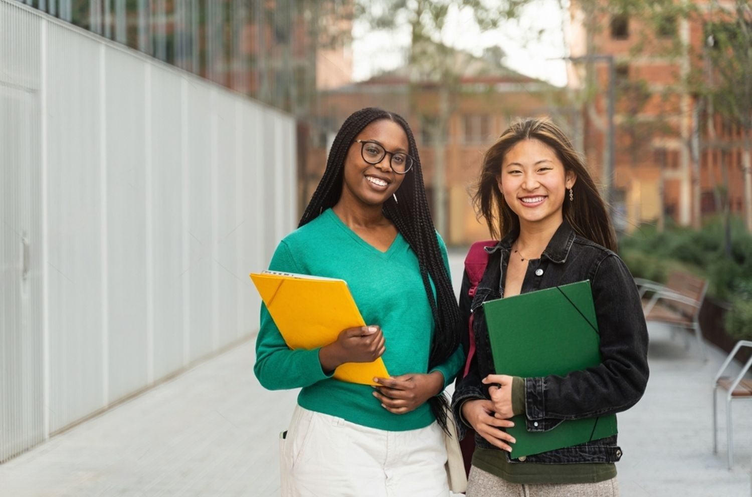 Stock Photo Two University Student Girls Looking At Camera Smiling Outdoors At The College Campus Asian And 2463722773 Transformed E1718882514164