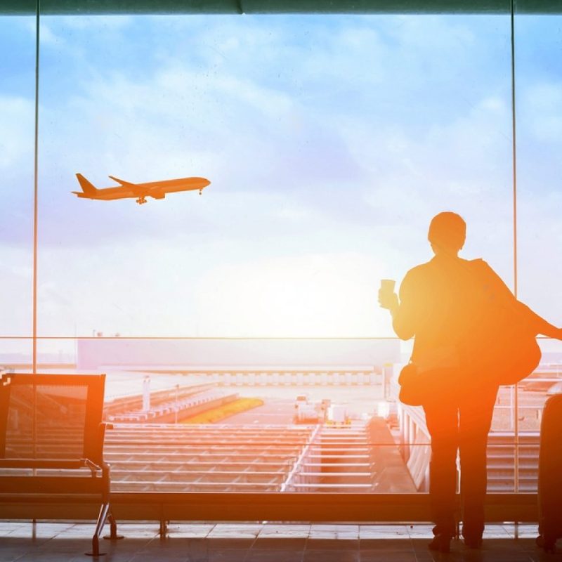 stock-photo-happy-traveler-waiting-for-the-flight-in-airport-departure-terminal-immigration-concept-497425381-transformed
